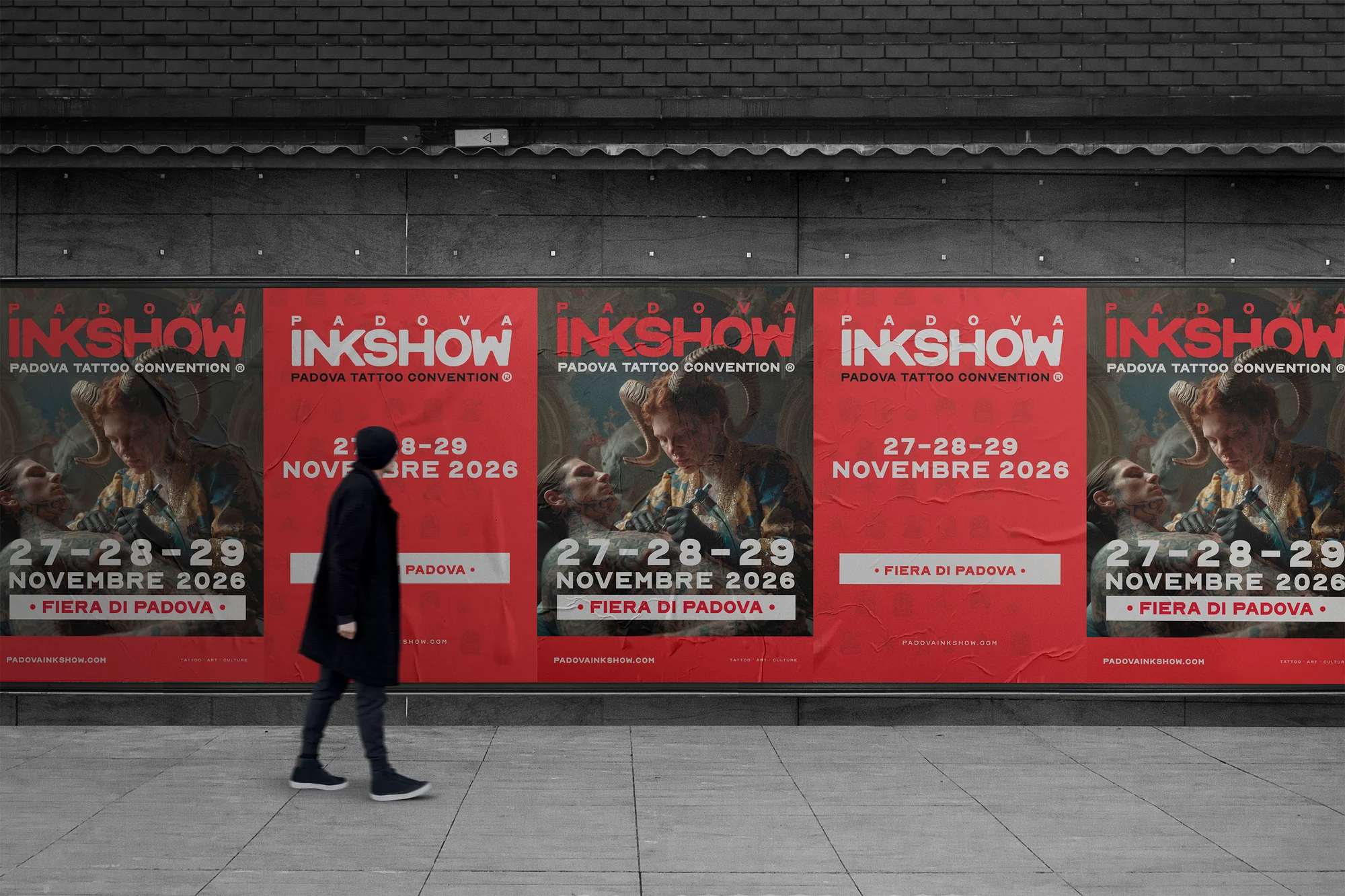 InkShow posters alternating illustrated artwork and red typography on a street wall