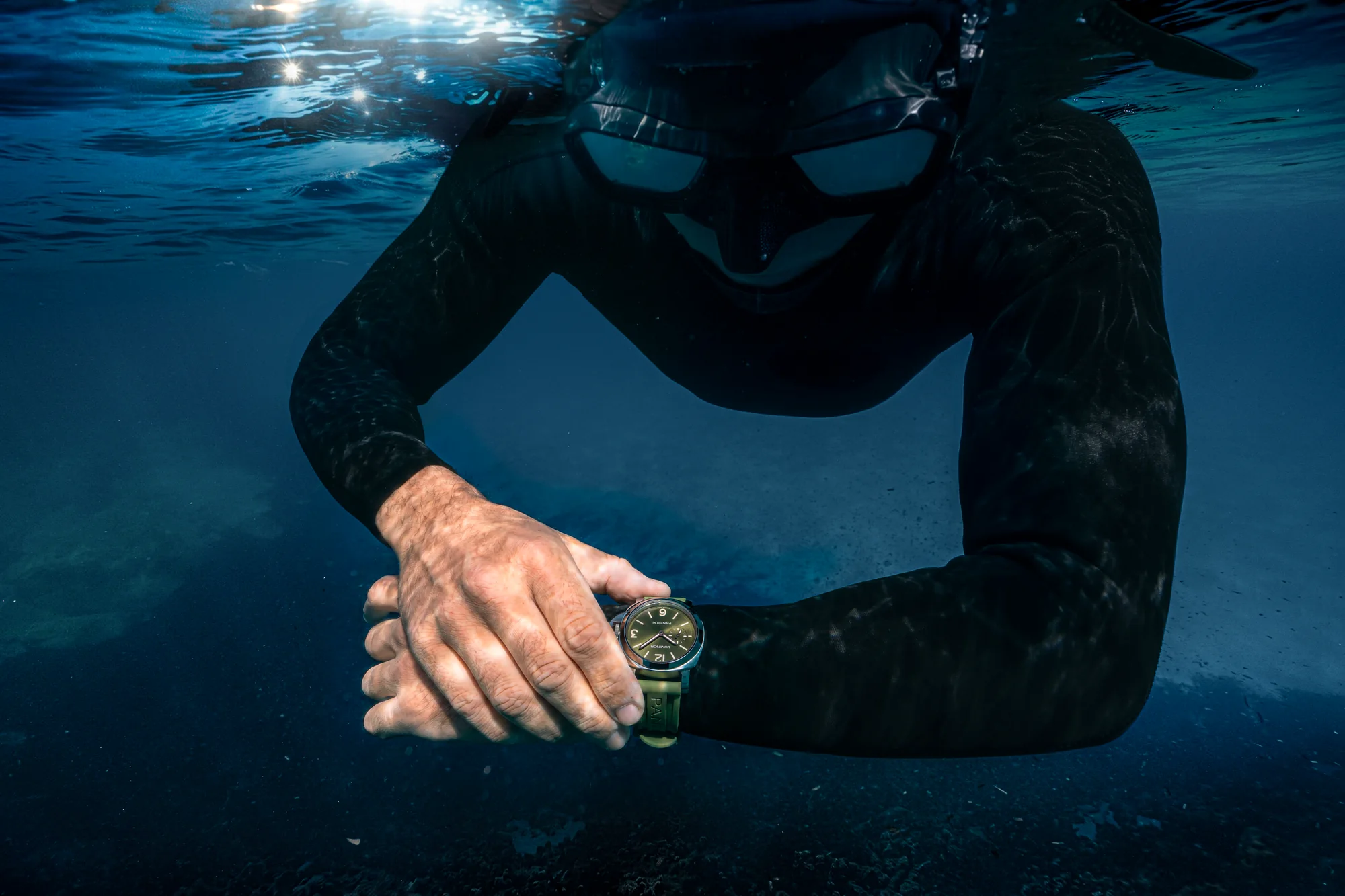 Diver wearing a green-dial Panerai Luminor 42mm